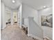 Upstairs hallway with carpeted floors showing bedroom doors and staircase at 499 Bishop Ln, Woodstock, GA 30188