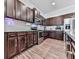 A spacious kitchen showcasing stainless steel appliances, granite countertops, and ample cabinet space at 499 Bishop Ln, Woodstock, GA 30188