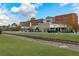 Scenic landscape with train tracks, green grass, and commercial buildings in Woodstock, GA at 499 Bishop Ln, Woodstock, GA 30188