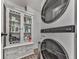 The laundry room features washer-dryer units, and a storage cabinet at 499 Bishop Ln, Woodstock, GA 30188