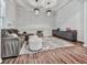 Comfortable living room with plush seating, soft rug, and dark wood floors at 499 Bishop Ln, Woodstock, GA 30188