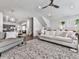 This open-concept living room is perfect for entertaining, featuring hardwood floors and stylish decor at 499 Bishop Ln, Woodstock, GA 30188