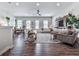 The expansive living room offers versatile space, hardwood floors, and a comfortable seating arrangement at 499 Bishop Ln, Woodstock, GA 30188