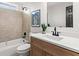 Modern bathroom with sleek fixtures, tile accent wall, and an updated vanity at 3208 Spruce Way, Atlanta, GA 30349