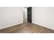 A neutrally decorated bedroom offers wood-look floors and closet at 3208 Spruce Way, Atlanta, GA 30349
