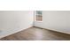 Neutral bedroom with bright window and modern wood-look floors at 3208 Spruce Way, Atlanta, GA 30349