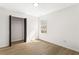 This bedroom features wood-look floors, a closet, and a bright window at 3208 Spruce Way, Atlanta, GA 30349