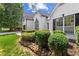 Exterior view of a home with manicured landscaping, stone edging, and lush greenery in the front yard at 3208 Spruce Way, Atlanta, GA 30349