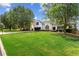 Picturesque home with a lush green lawn and mature trees, offering great curb appeal at 3208 Spruce Way, Atlanta, GA 30349