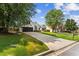 A well-maintained lawn and extended driveway highlight this charming suburban home at 3208 Spruce Way, Atlanta, GA 30349