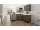 Updated kitchen featuring stainless steel appliances and quartz countertops offers an open concept to the adjacent room at 3208 Spruce Way, Atlanta, GA 30349