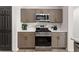 This beautifully renovated kitchen features stainless steel appliances and matte finish cabinets at 3208 Spruce Way, Atlanta, GA 30349