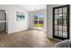 Bright sun room with large windows, light colored walls, and luxury vinyl plank flooring at 3208 Spruce Way, Atlanta, GA 30349