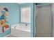 Bathroom with soaking tub, separate shower, and decorative paint at 3419 Allie Dr, Snellville, GA 30039