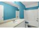 Bright bathroom featuring a large vanity, blue accents and shower with white tub at 3419 Allie Dr, Snellville, GA 30039