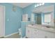 Bright bathroom featuring dual sinks, tile floors, and large mirror at 3419 Allie Dr, Snellville, GA 30039
