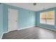 Bedroom with wood-look flooring and neutral paint at 3419 Allie Dr, Snellville, GA 30039