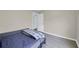 Bedroom featuring gray wood-look floors and calming neutral walls and trim at 3419 Allie Dr, Snellville, GA 30039