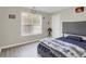 Comfortable bedroom features wood-look floors, large window, and a stylish padded headboard at 3419 Allie Dr, Snellville, GA 30039