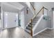 Stairway featuring carpeted stairs, gray walls, and light wood handrail leading to the second story at 3419 Allie Dr, Snellville, GA 30039