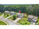 Aerial view of a two-story home with a well-manicured lawn and long driveway at 588 Joneus Dr, Mcdonough, GA 30252