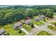 A charming home with a well-kept yard, mature trees, and neighborhood street at 588 Joneus Dr, Mcdonough, GA 30252