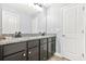 Bathroom showcases a double vanity with granite counters and dark cabinetry at 588 Joneus Dr, Mcdonough, GA 30252