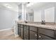 Bathroom with double vanity featuring granite countertops and dark cabinetry at 588 Joneus Dr, Mcdonough, GA 30252