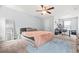 Bedroom with a ceiling fan, carpet, ample space, a large bed, and an area for an office setup at 588 Joneus Dr, Mcdonough, GA 30252