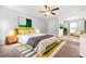 Spacious main bedroom with a ceiling fan, carpet, and neutral paint at 588 Joneus Dr, Mcdonough, GA 30252