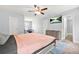 Large bedroom featuring a ceiling fan, closet, neutral paint, and space for an office at 588 Joneus Dr, Mcdonough, GA 30252