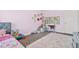 Light purple bedroom with playful decor, carpet, and white trim at 588 Joneus Dr, Mcdonough, GA 30252
