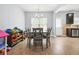 Inviting dining area near the kitchen, featuring a wooden table and an ample amount of toy storage at 588 Joneus Dr, Mcdonough, GA 30252
