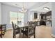 Open dining area next to the kitchen featuring a wooden table and natural lighting at 588 Joneus Dr, Mcdonough, GA 30252