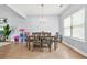 Well-lit dining area with a modern table, stylish chairs, and a view through the window at 588 Joneus Dr, Mcdonough, GA 30252