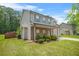 Two-story home with stone accents, covered porch, well maintained lawn, and mature landscaping at 588 Joneus Dr, Mcdonough, GA 30252