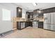 Well-equipped kitchen featuring stainless steel appliances, dark cabinets, and ample counter space at 588 Joneus Dr, Mcdonough, GA 30252