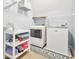 Well organized laundry room featuring modern washer and dryer and sewing machine at 588 Joneus Dr, Mcdonough, GA 30252