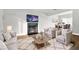 Cozy living room with a fireplace, comfortable seating, and a large screen television at 588 Joneus Dr, Mcdonough, GA 30252