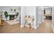 View of the living room with fireplace, view of the kitchen, and modern furnishings at 588 Joneus Dr, Mcdonough, GA 30252