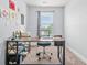 Office with natural light, desk, rolling chair, and carpeted floor at 588 Joneus Dr, Mcdonough, GA 30252