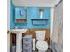 Bathroom featuring a sink, toilet, and gray storage drawers at 6178 Field Stone Dr, Douglasville, GA 30134