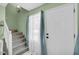 Charming entryway with a staircase, window with curtains, and a welcoming door at 6178 Field Stone Dr, Douglasville, GA 30134