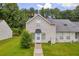 Inviting two-story home with a well-maintained lawn and charming curb appeal in a lush, green neighborhood at 6178 Field Stone Dr, Douglasville, GA 30134