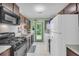 Functional kitchen featuring appliances, ample cabinet space, and easy access to the backyard at 6178 Field Stone Dr, Douglasville, GA 30134