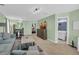 Open-concept living room with a sleek TV, stylish furniture, and a view into the bathroom at 6178 Field Stone Dr, Douglasville, GA 30134