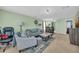 Bright living room with a plush sofa, decorative pillows, and a cozy rug at 6178 Field Stone Dr, Douglasville, GA 30134