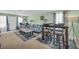 Spacious living area with comfortable seating, a dining table, and large windows at 6178 Field Stone Dr, Douglasville, GA 30134