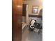 A compact bathroom featuring black fixtures and tilework surrounding the sink and toilet at 718 South Ave, Forest Park, GA 30297