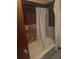A view of the bathtub and shower with tiling in the bathroom at 718 South Ave, Forest Park, GA 30297